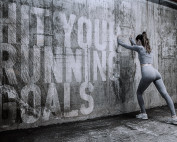 Fitness Model Photographer Liverpool - photo of fitness model next to concrete